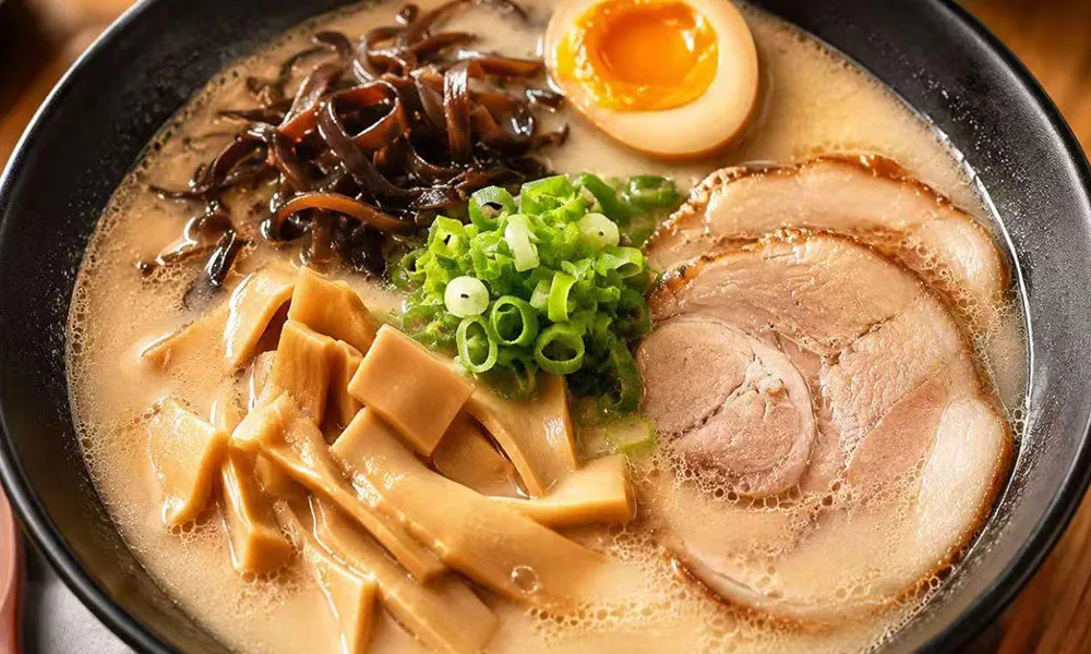 Rich tonkotsu ramen with chashu, menma, wood ear mushrooms, and green onions at Yu San, a Japanese Restaurant in East Stroudsburg